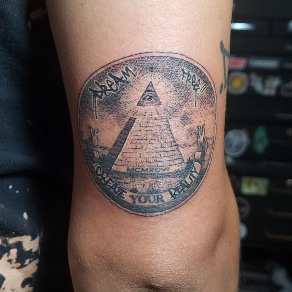 Sacred Mandala Studio tattoo artist - Britney Farmer - black and grey all seeing eye create your reality tattoo.